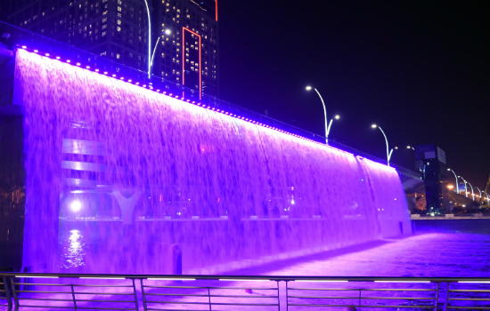 A beautiful view of Dubai water canal with opened water and lights
