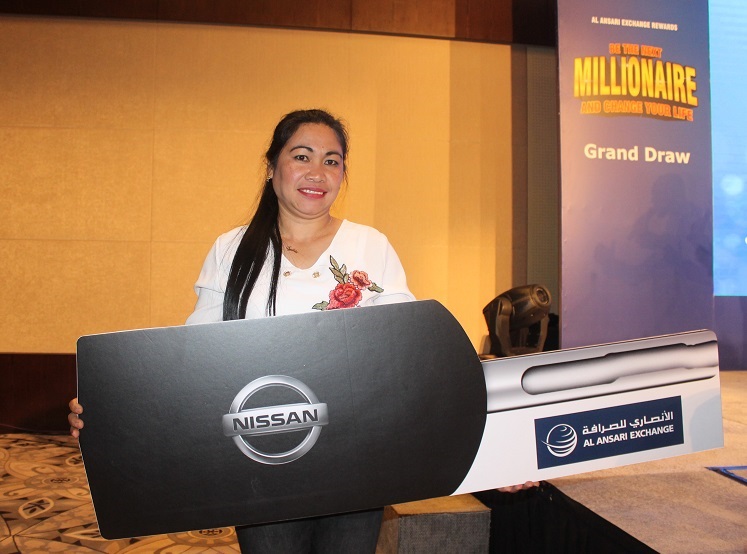 Silvia Valdez winner of a brand new Nissan Patrol from Al Ansari Exhange Rewards grand raffle promo. Gelin Castro