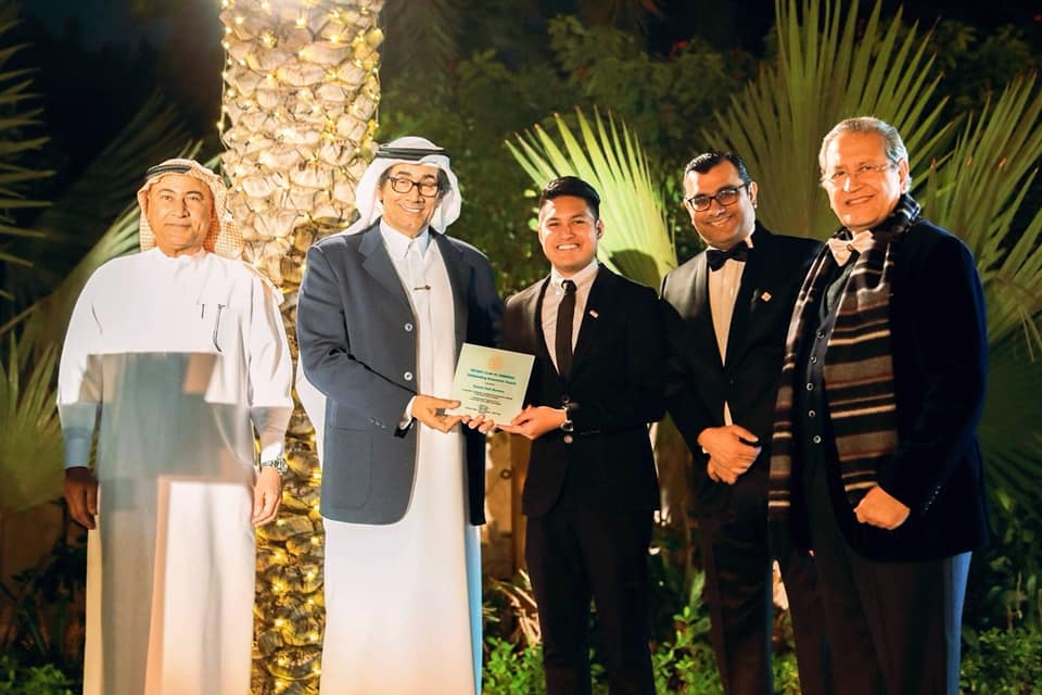 receiving award for community service by rotary club jumeirah