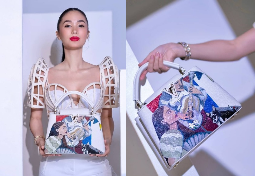 Heart Evangelista, the artist, paints branded bags