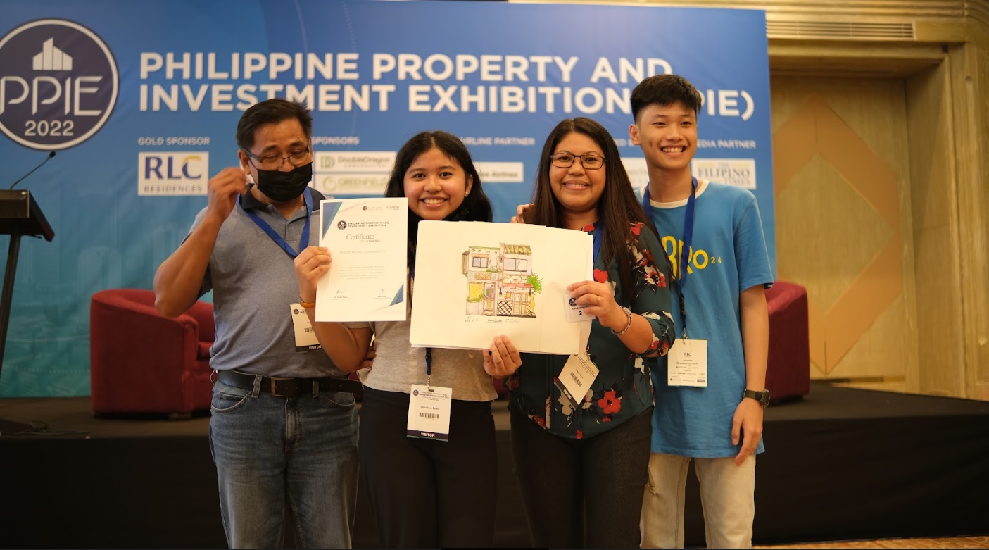 Fionah Laysa (2nd from left), with her family, holds her winning piece in the Grades 4 to 7 category of PPIE’s What’s Your Dream House? Competition.