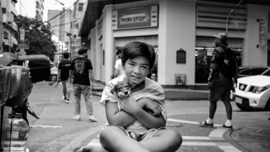 The true love and bond between Filipino people and their pet dogs. This photo is my personal favourite. A street seller holding his dog beneath his shirt, sitting next to his cart. Image taken with Fujifilm XT-4 and Tokina 33,, F1.4 X lens.