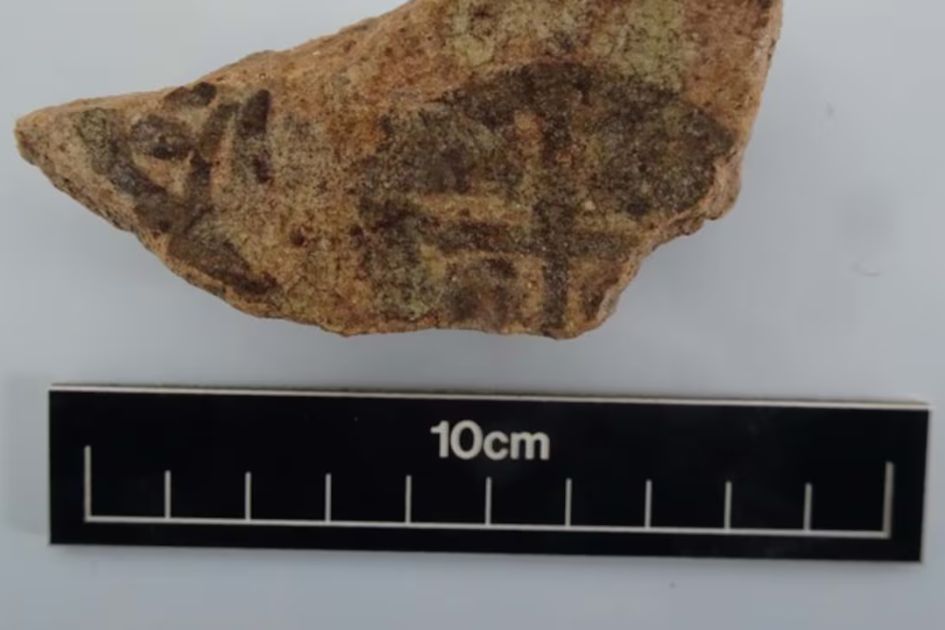 pottery piece with cross mark the national